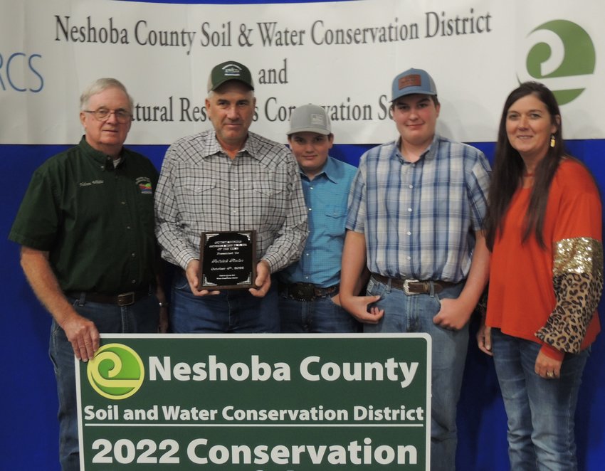 2022 Conservation Farmer of the Year was Patrick Pinter, second from left, pictured with his family and Neshoba SWCD Chairman Nelson White, left­.